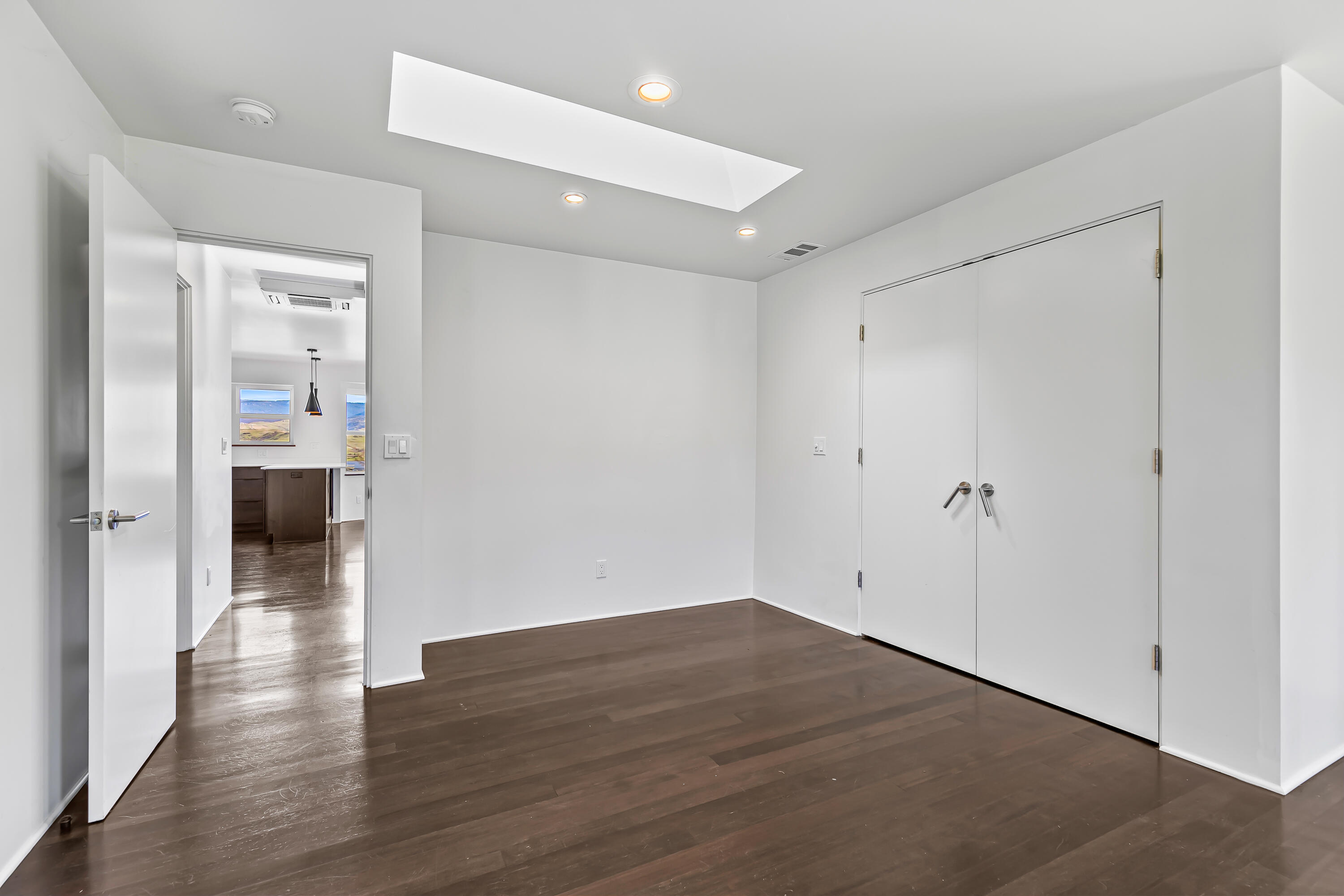 593 Crowson Road Ashland, OR 97520 - Photo 11 of 36 a view of a hallway with wooden floor
