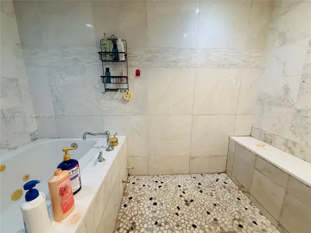 a bathroom with a bathtub sink and toilet