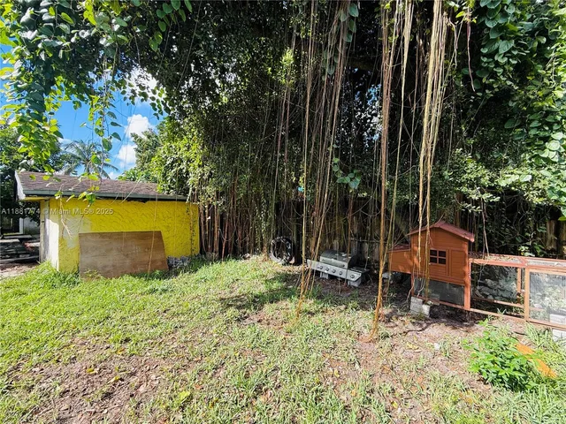 a view of backyard with swimming pool