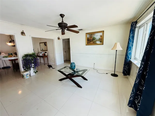 a room with gym equipment and a flat screen tv