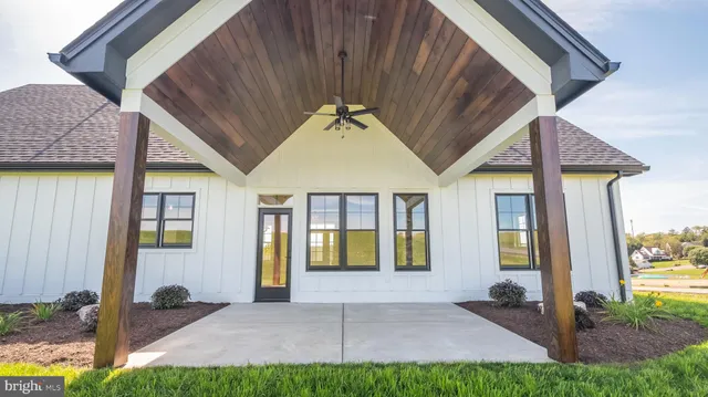 a kitchen with stainless steel appliances granite countertop a stove a refrigerator and a microwave