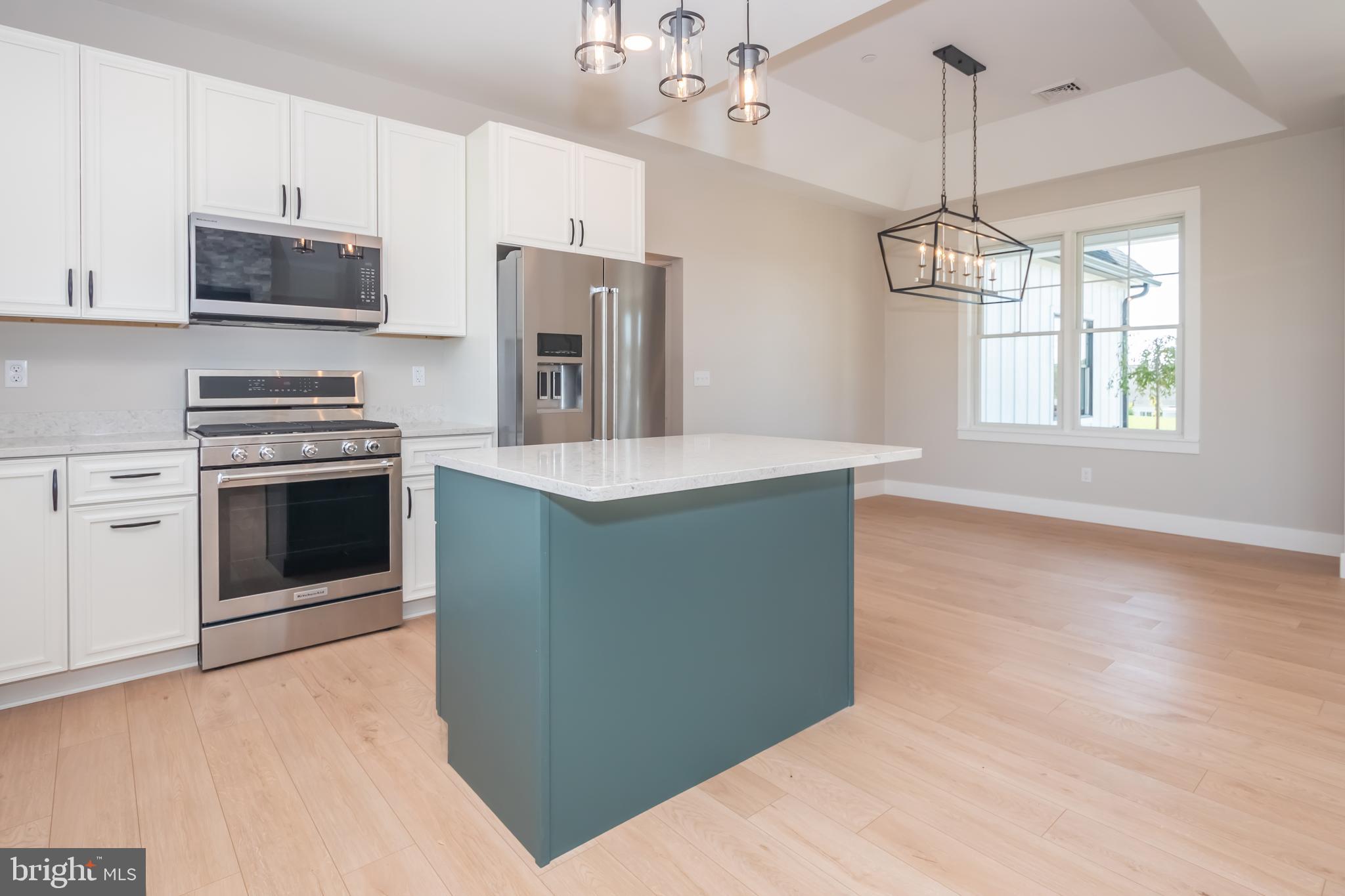 71 Walnut Ridge Grantsville, MD 21536 - Photo 13 of 55 a kitchen with stainless steel appliances granite countertop a stove a refrigerator and a microwave