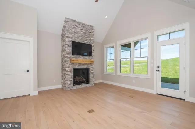 a view of a kitchen with furniture and a fireplace
