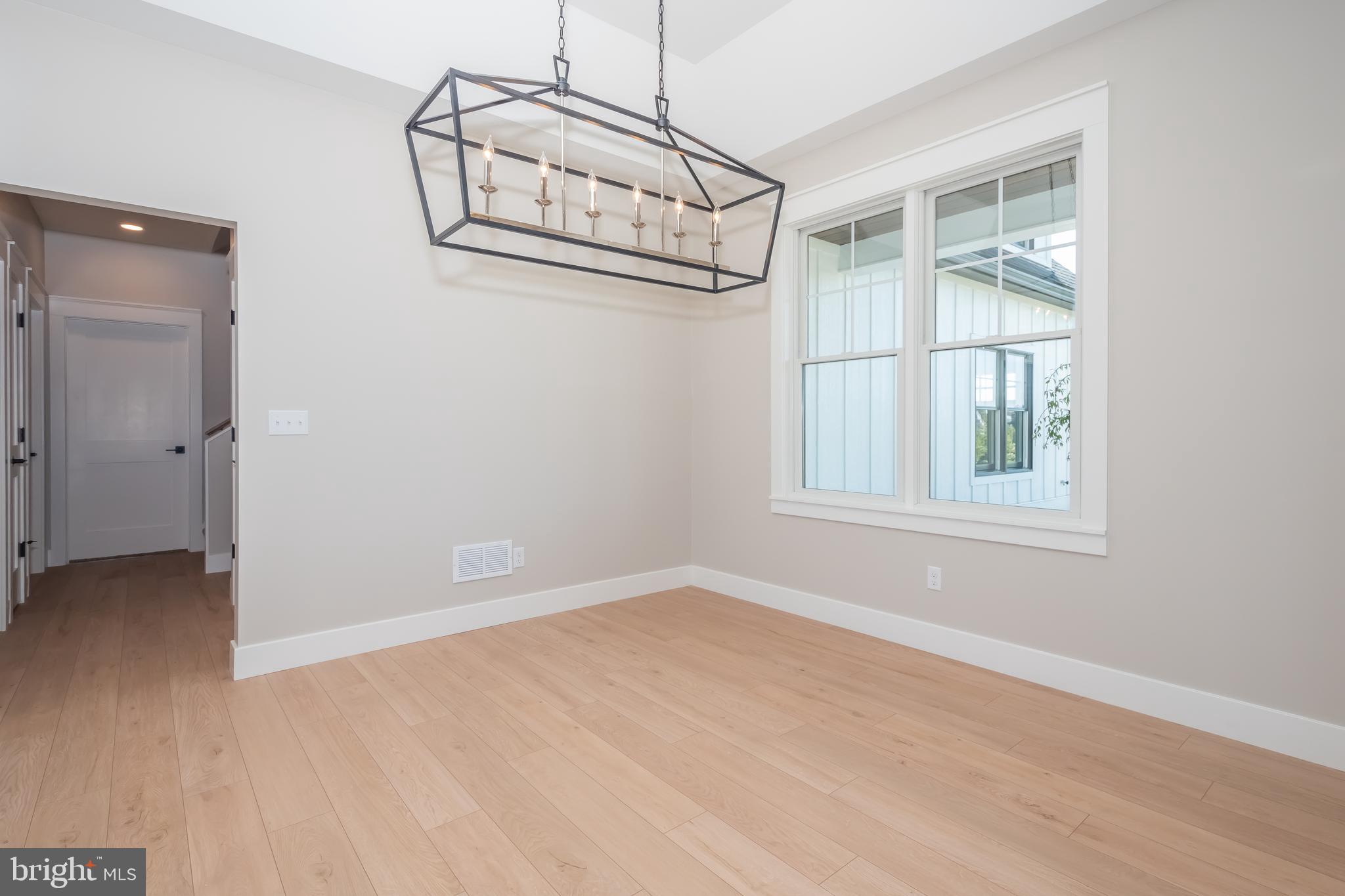 71 Walnut Ridge Grantsville, MD 21536 - Photo 26 of 55 an empty room with wooden floor and windows