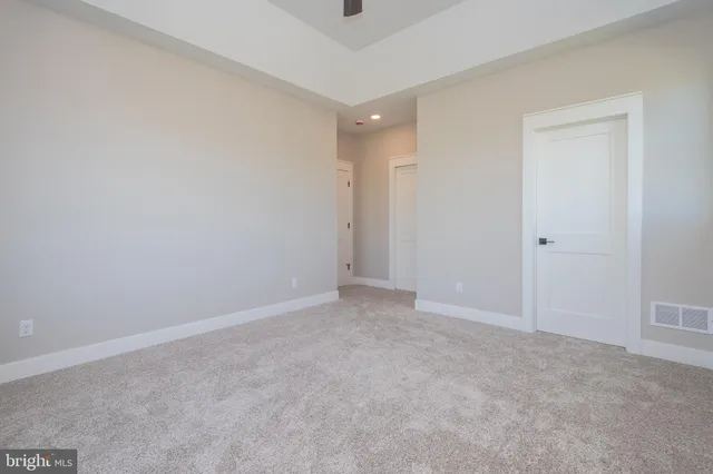 a bathroom with a granite countertop shower