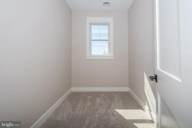 a view of a room with wooden walls