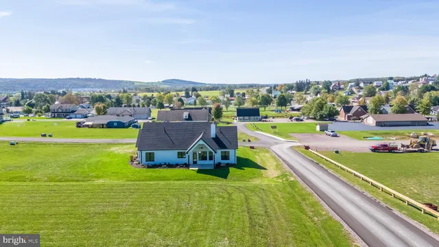 an aerial view of a house with a garden