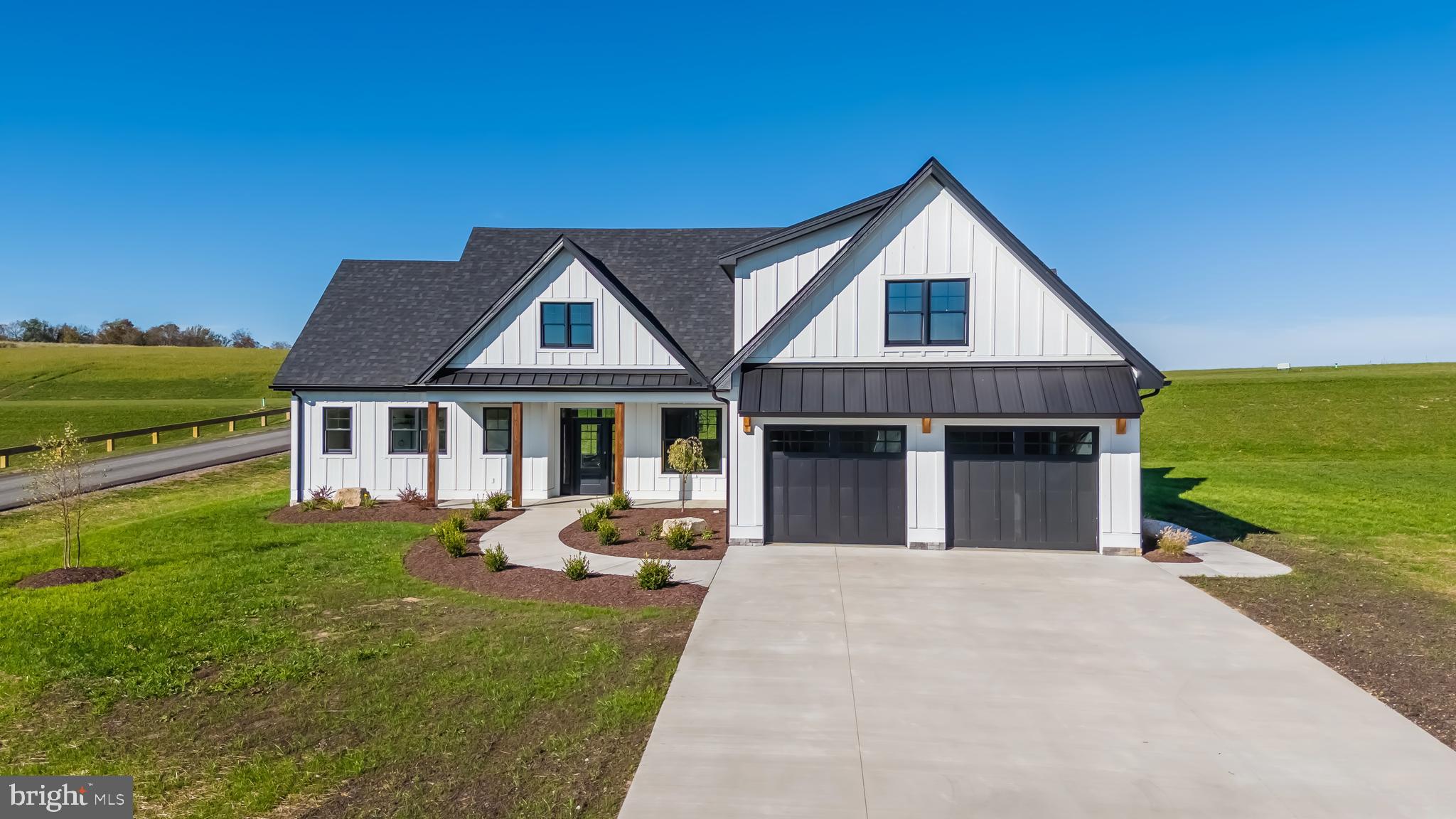 71 Walnut Ridge Grantsville, MD 21536 - Photo 9 of 55 a front view of a house with a yard table and chairs