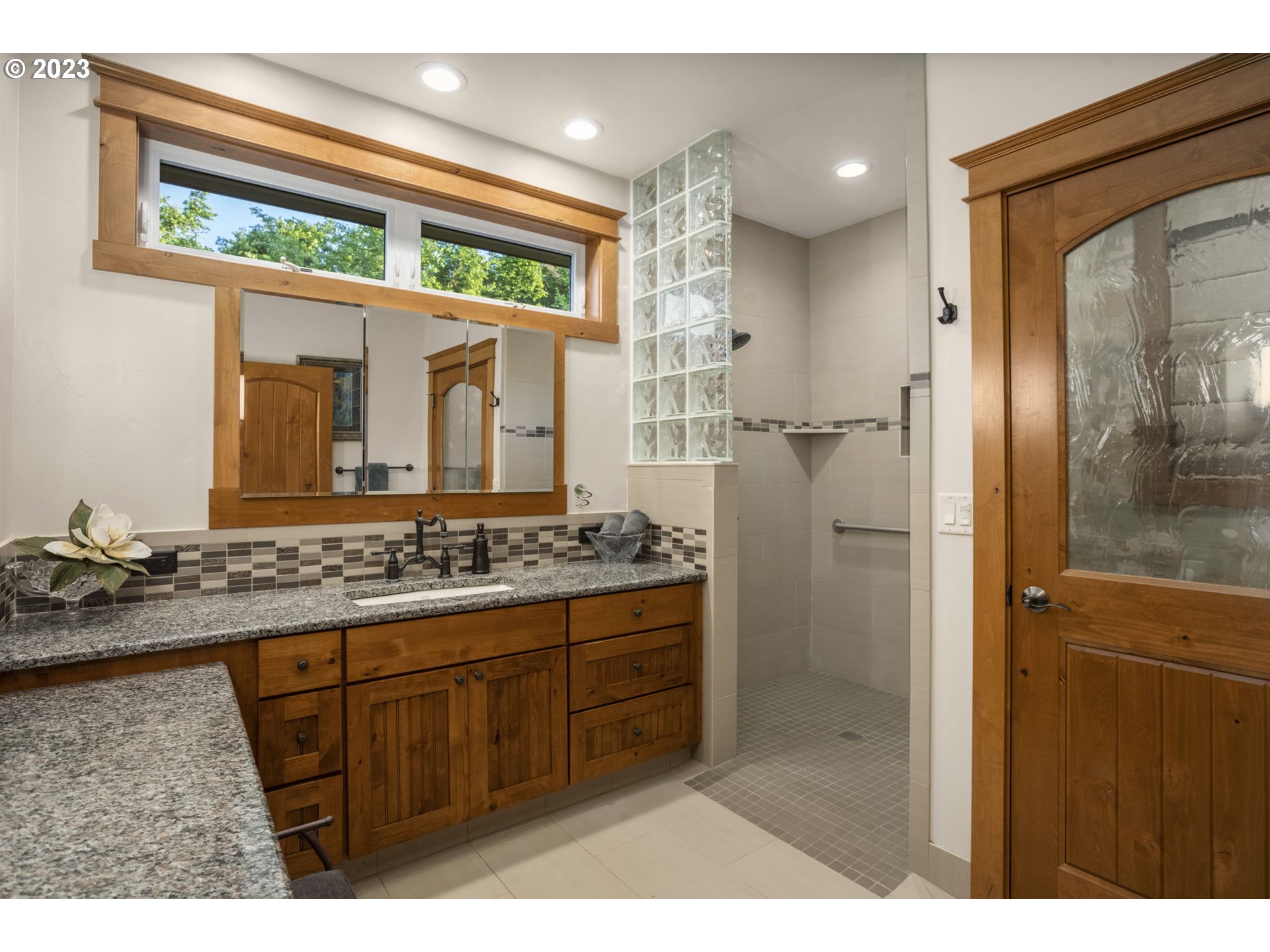 4185 Southwest Lafollett Road Cornelius, OR 97113 - Photo 20 of 45 a bathroom with a granite countertop sink a mirror and shower
