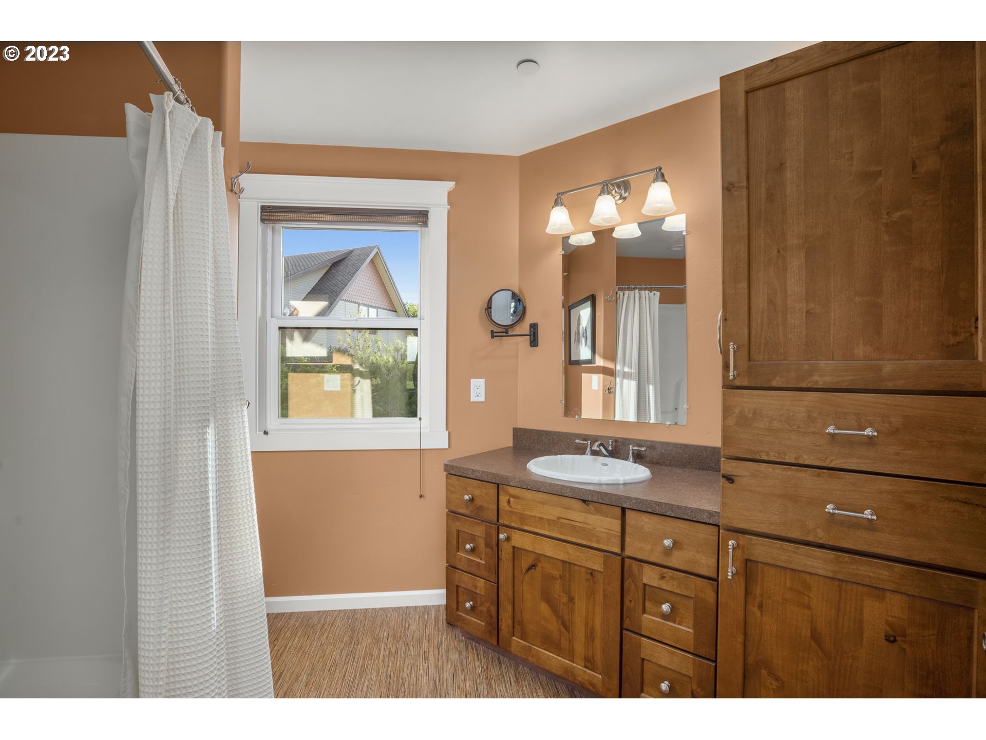 4185 Southwest Lafollett Road Cornelius, OR 97113 - Photo 23 of 45 a bathroom with a sink mirror and window