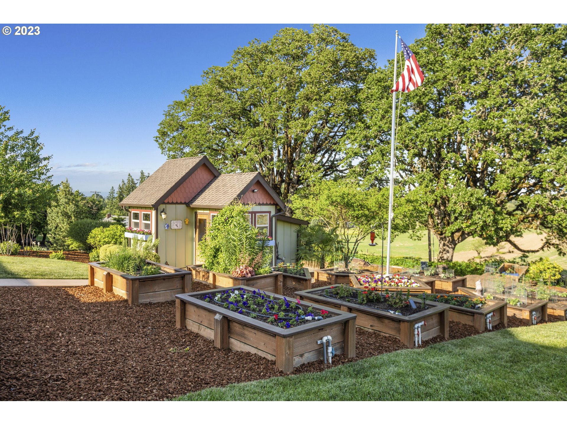 4185 Southwest Lafollett Road Cornelius, OR 97113 - Photo 32 of 45 a backyard of a house with table and chairs