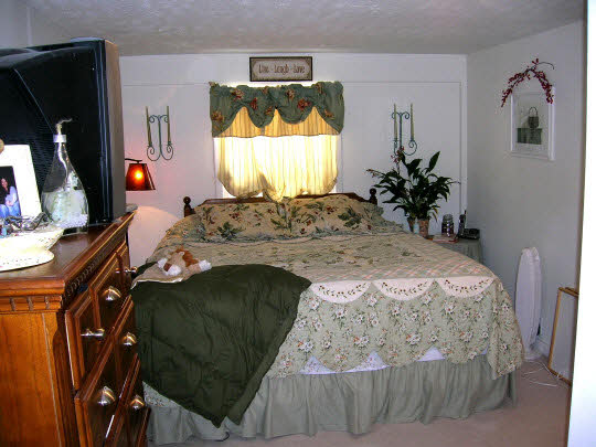 820 8th Street Rochelle, IL 61068 - Photo 3 of 6 a bed sitting in a bedroom next to a window