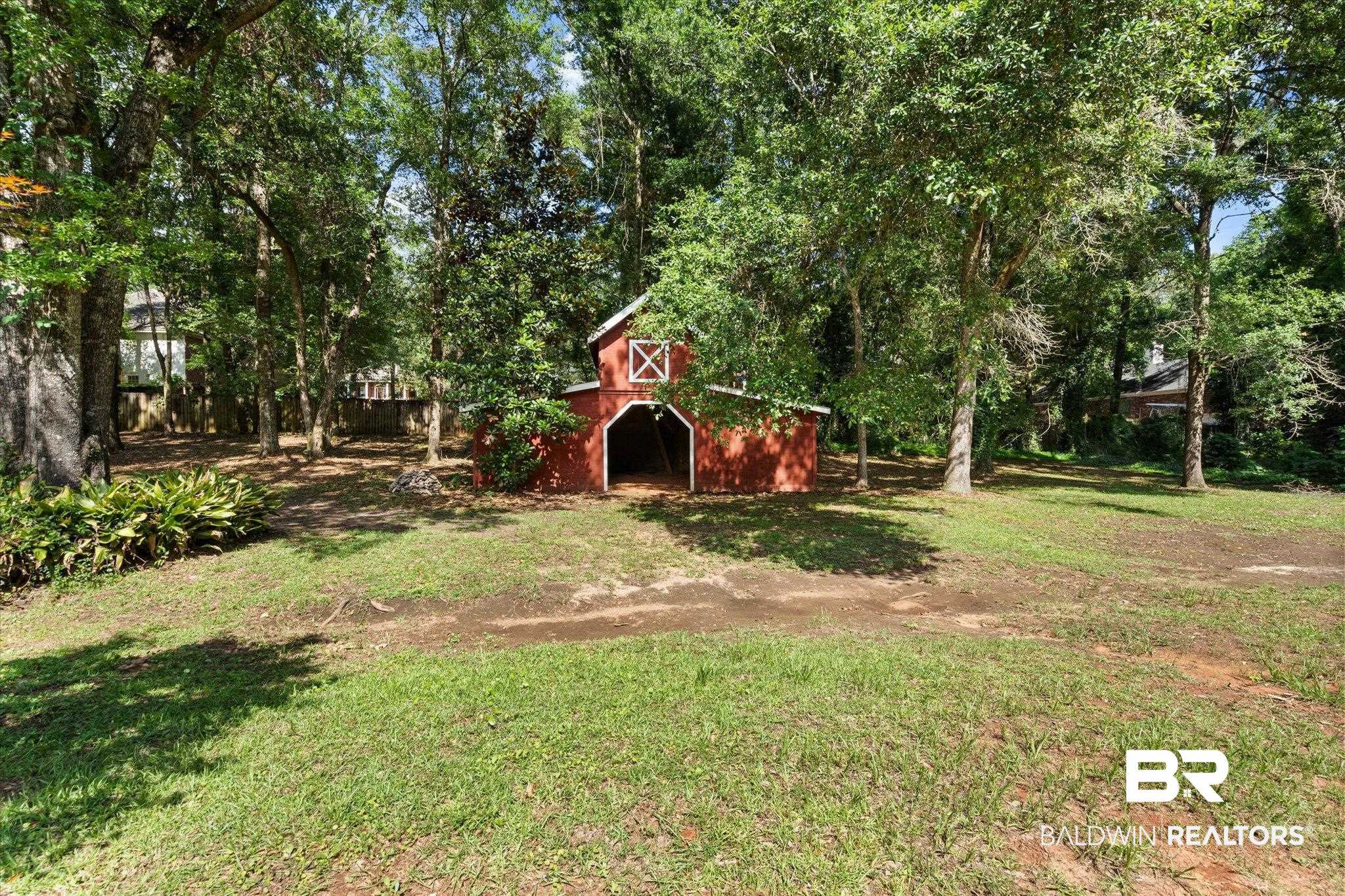 3715 Latigo Road Mobile, AL 36695 - Photo 24 of 39 View of grassy yard featuring a barn and an outbuilding