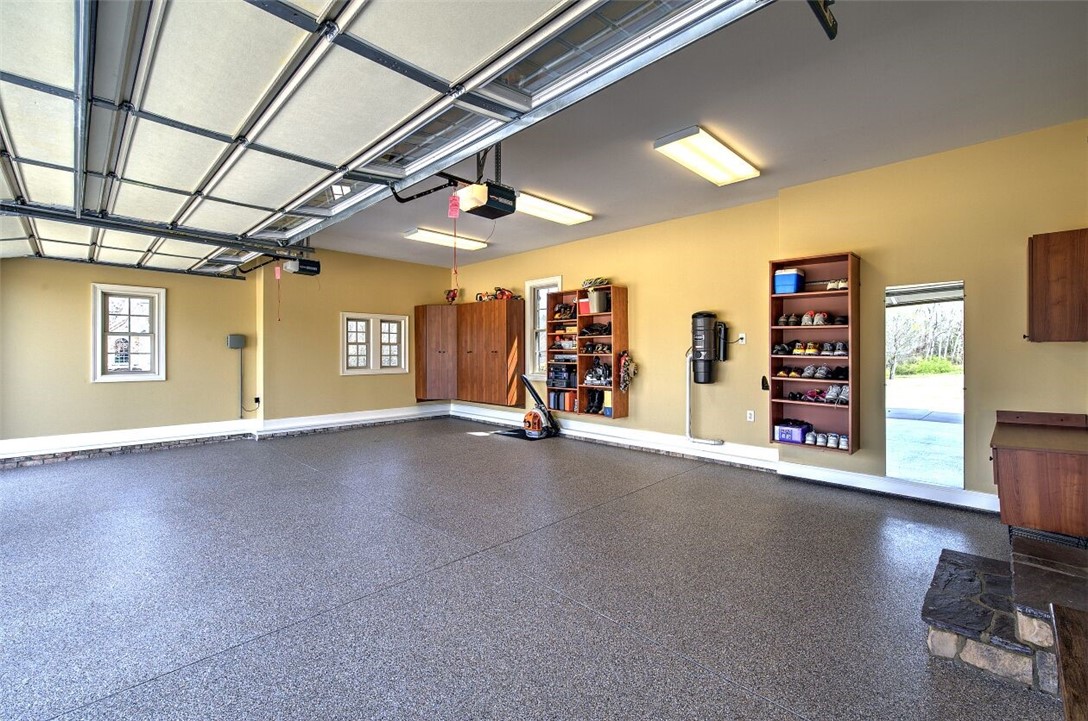 108 Bree Drive Anderson, SC 29621 - Photo 30 of 43 3-car garage with finished flooring & custom shelv