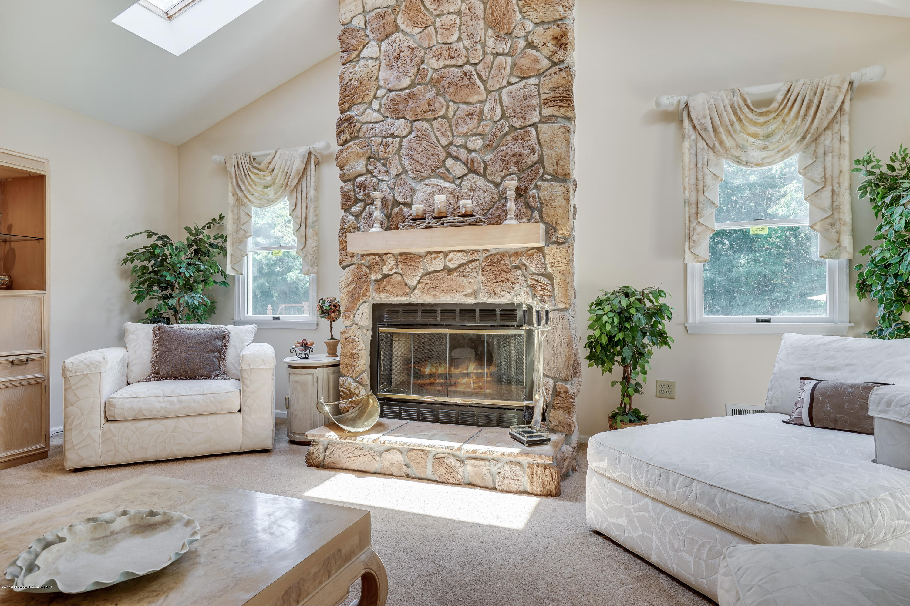 6 Overlook Drive Jackson, NJ 08527 - Photo 18 of 50 a living room with furniture and a fireplace