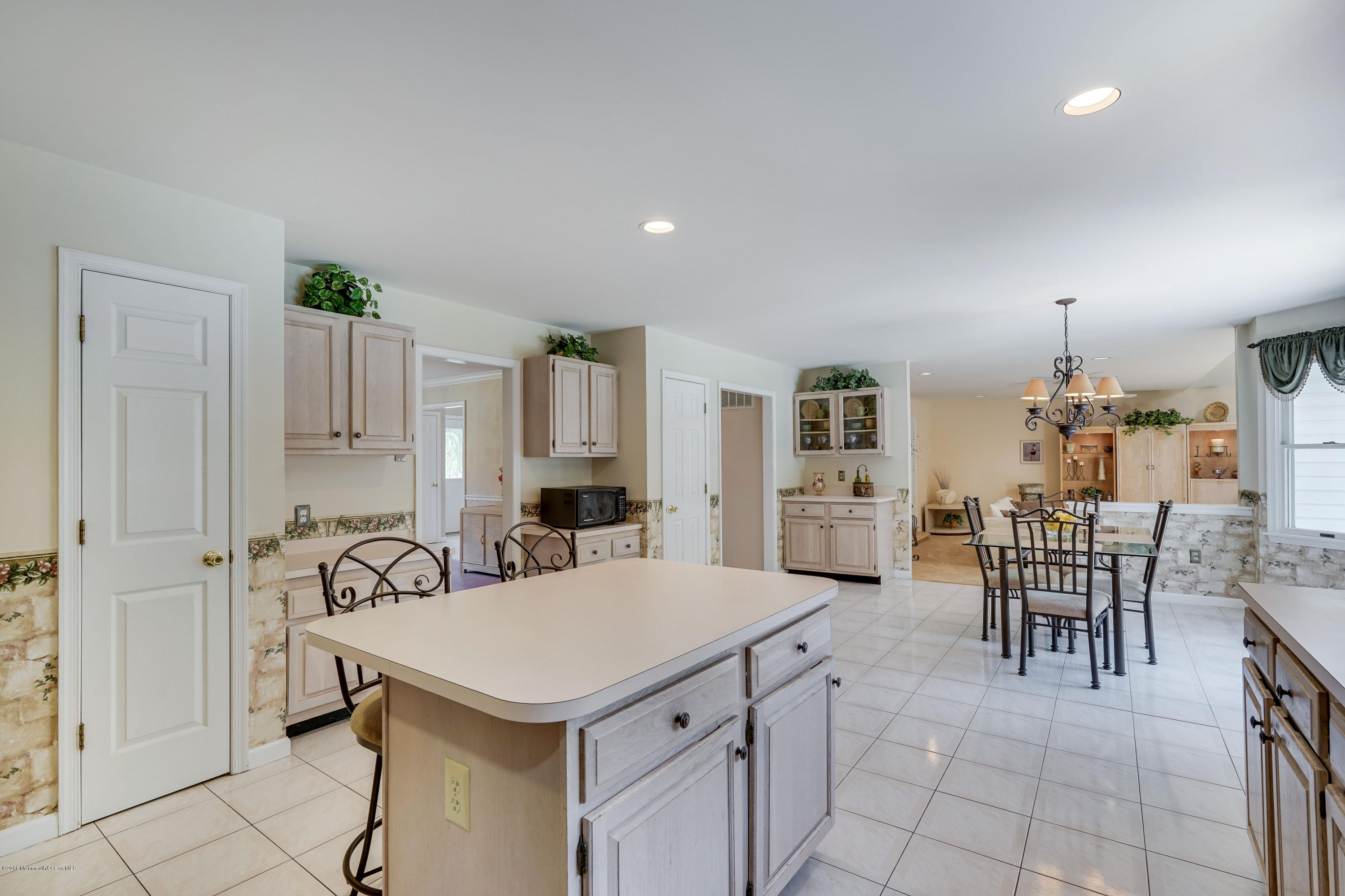 6 Overlook Drive Jackson, NJ 08527 - Photo 24 of 50 a kitchen with a table chairs and a refrigerator