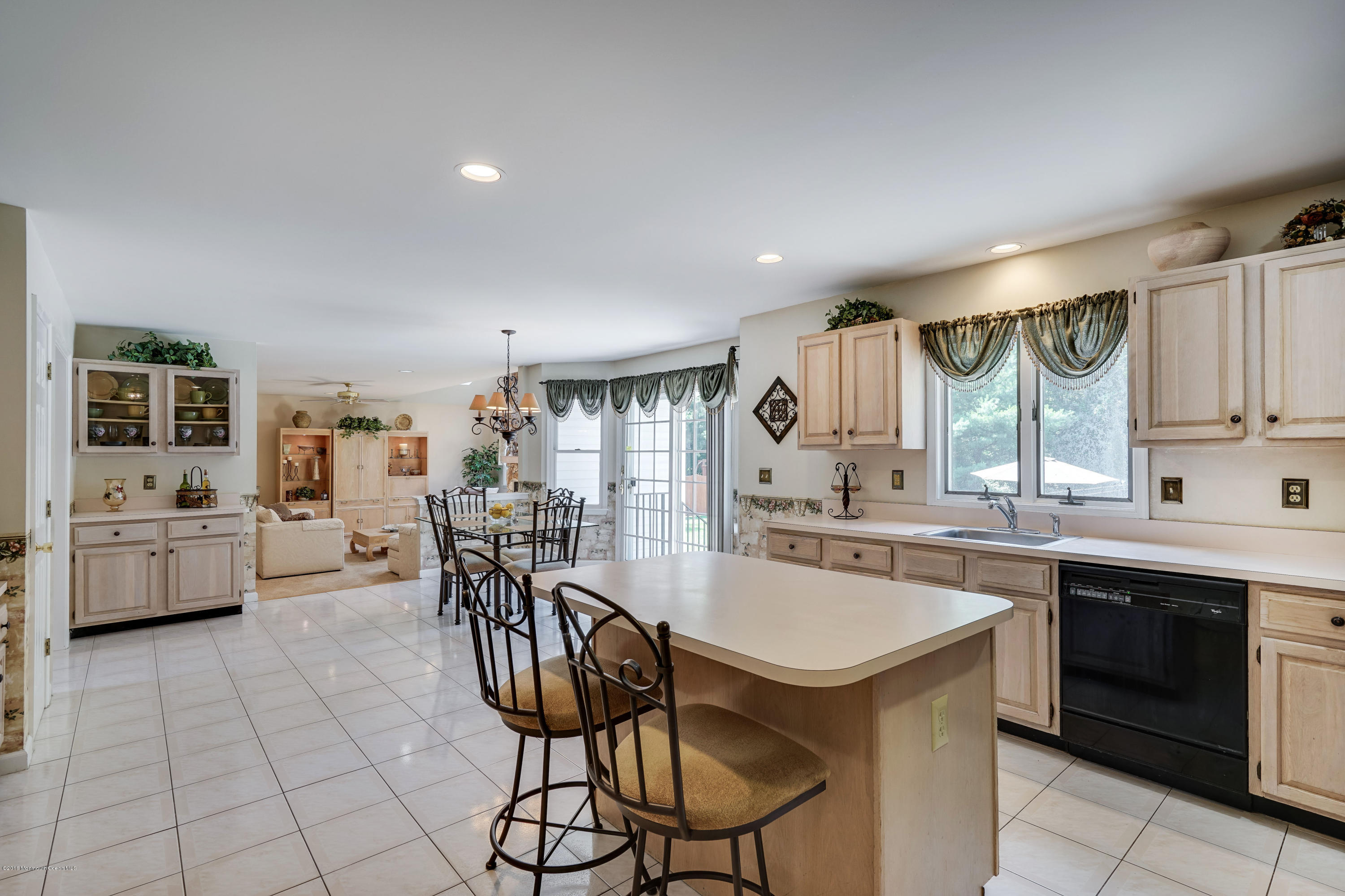 6 Overlook Drive Jackson, NJ 08527 - Photo 25 of 50 a kitchen with stainless steel appliances a table and chairs in it
