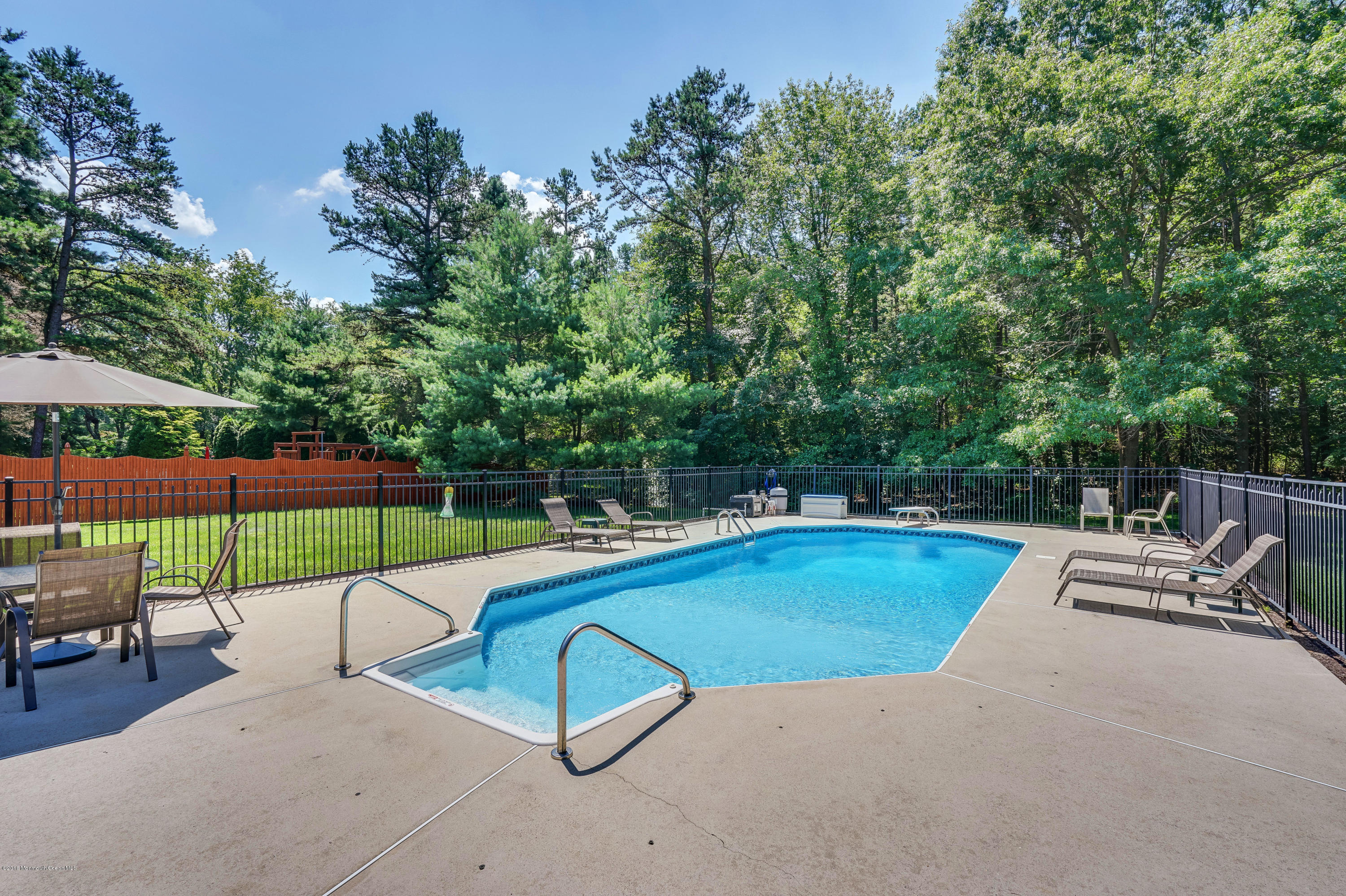 6 Overlook Drive Jackson, NJ 08527 - Photo 47 of 50 a view of a swimming pool with a lounge chair