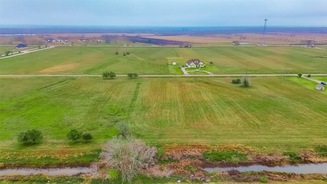 354 Brahman Trail Angleton, TX 77515 - Photo 4 of 6 a view of an outdoor space and a lake view