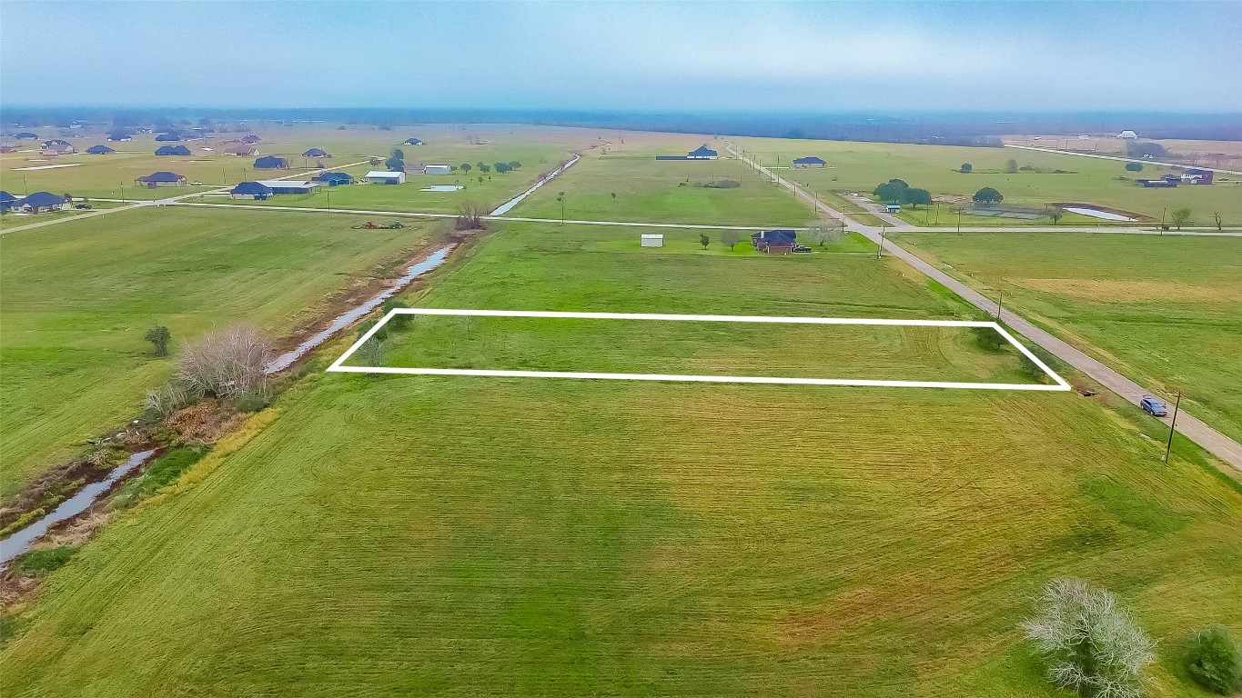 354 Brahman Trail Angleton, TX 77515 - Photo 6 of 6 a view of an outdoor space and tennis court
