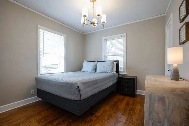 a bedroom with a bed and window