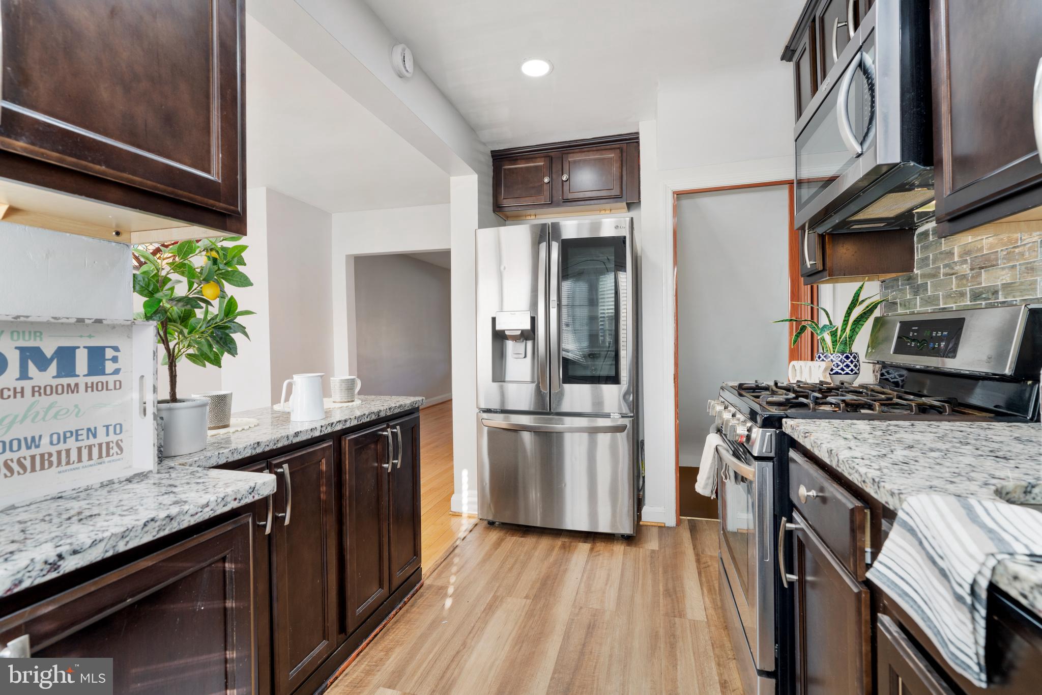404 Grovethorn Road Baltimore, MD 21220 - Photo 14 of 39 a kitchen with a stove and a kitchen