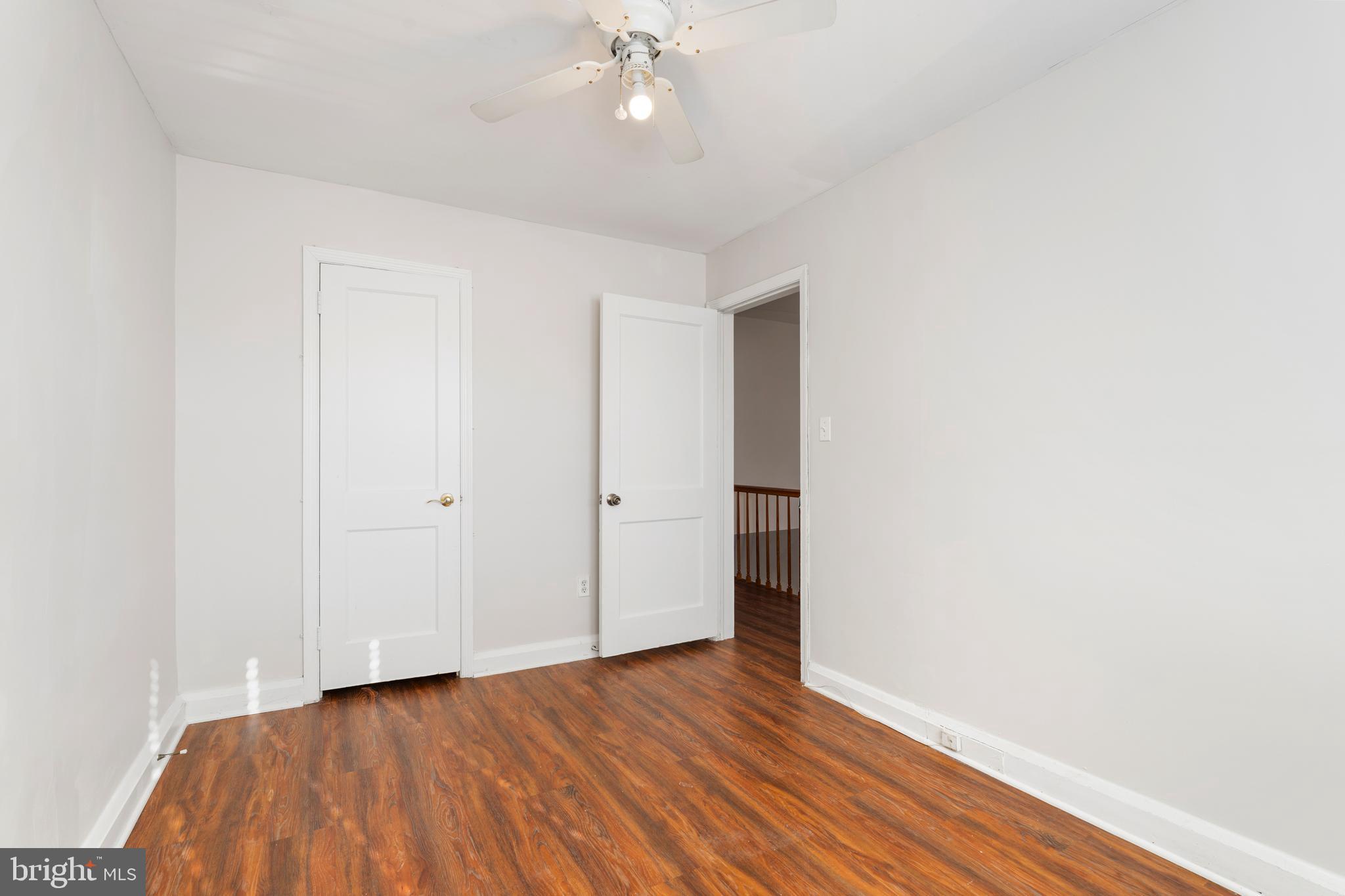 404 Grovethorn Road Baltimore, MD 21220 - Photo 24 of 39 a view of an empty room with wooden floor