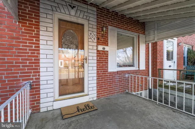 a view of a brick house with a street