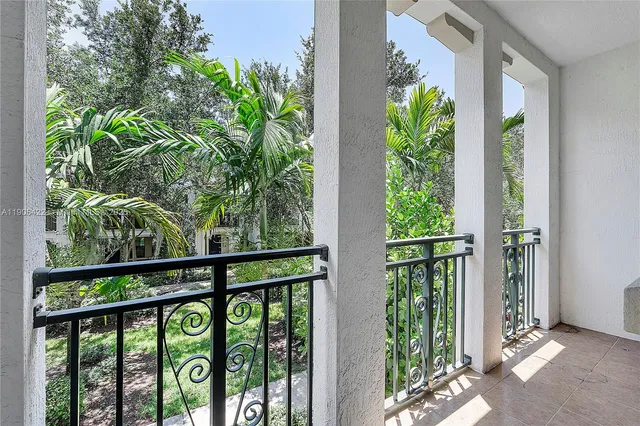a view of a balcony with plants