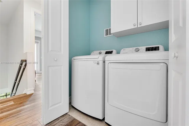 a utility room with dryer and washer