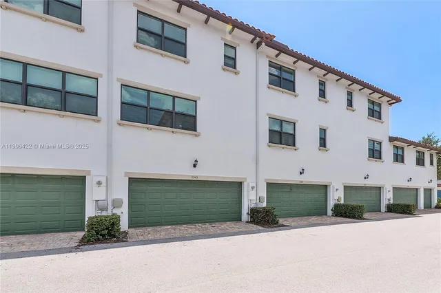 a front view of a house with garage