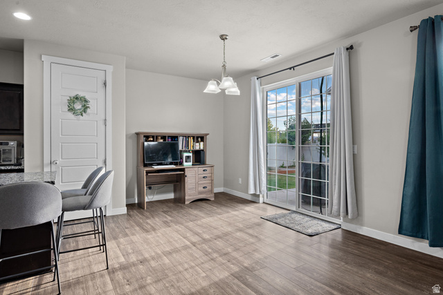 1074 South 750 West Springville, UT 84663 - Photo 8 of 28 Wood-finish flooring throughout, featuring a five-panel interior door and a sliding glass patio door
