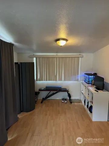 a bedroom with a bed and cabinets
