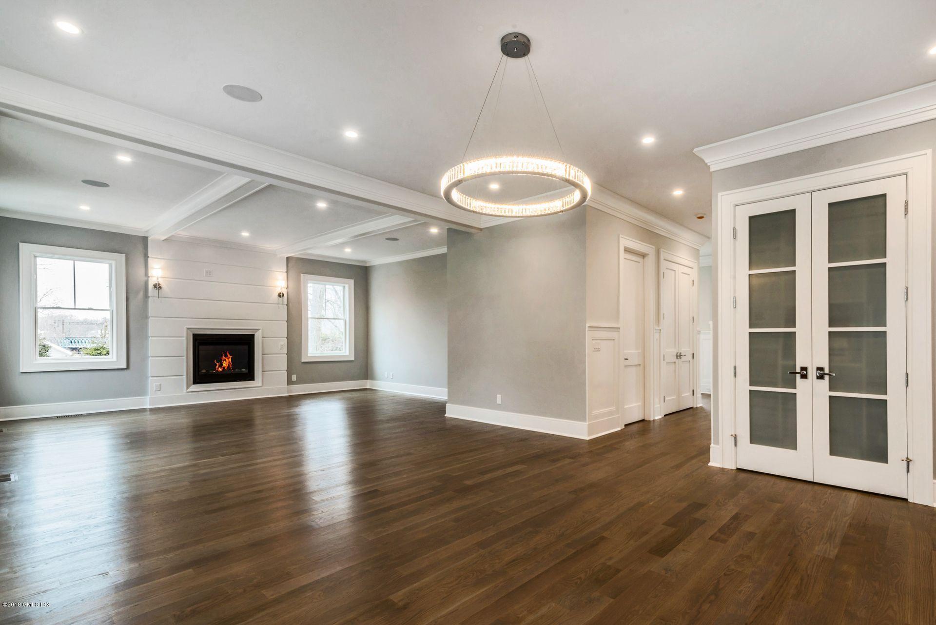 5 Club Road Riverside, CT 06878 - Photo 12 of 45 an empty room with wooden floor and a fireplace