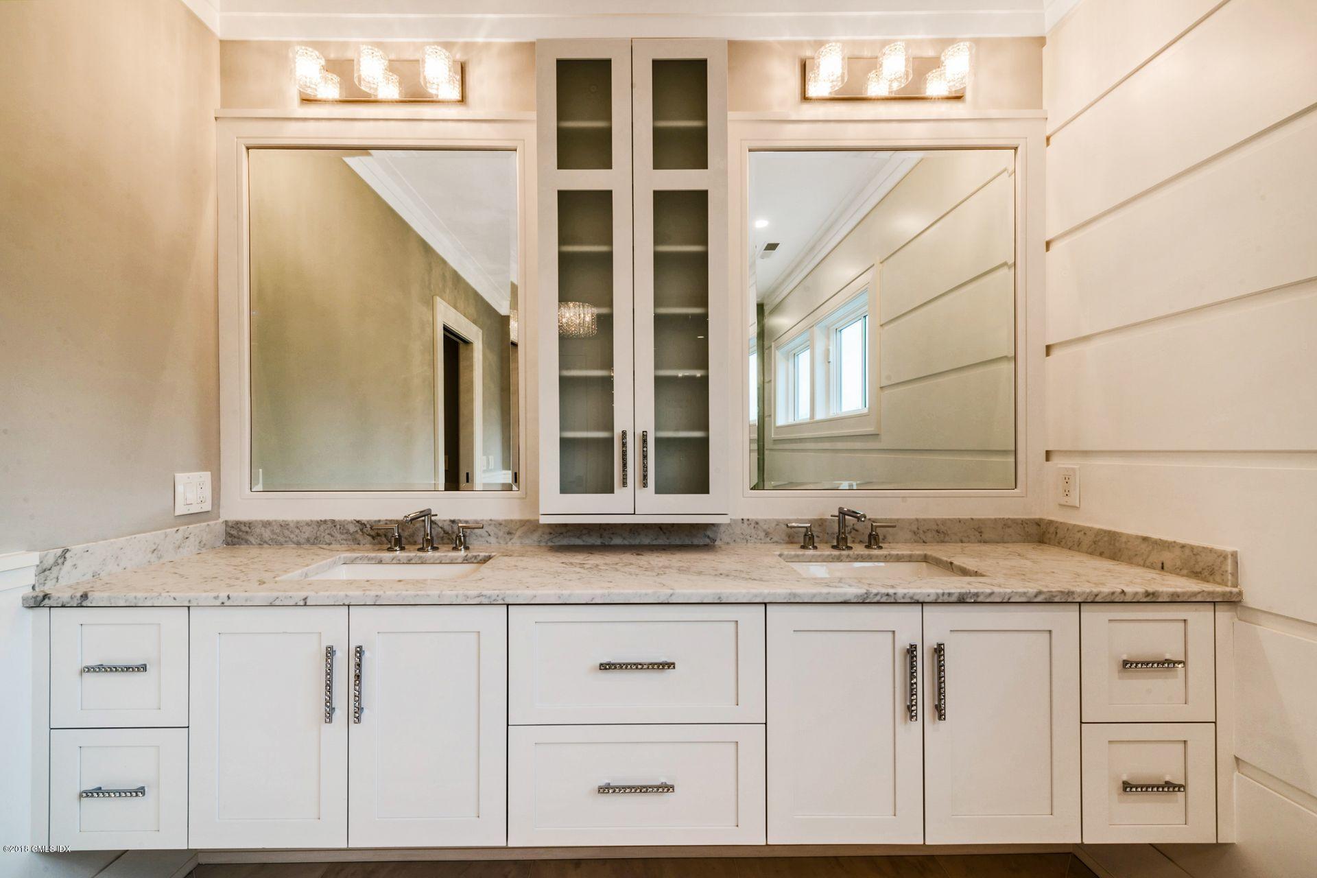 5 Club Road Riverside, CT 06878 - Photo 27 of 45 a bathroom with a sink and a mirror