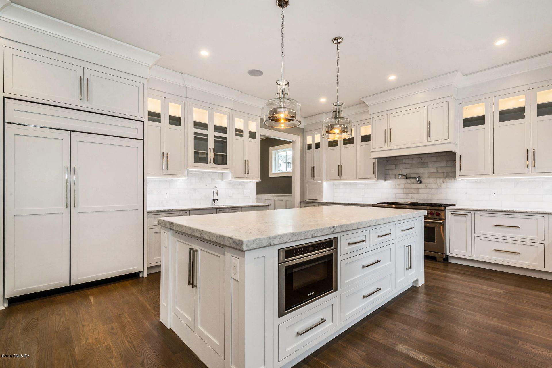 5 Club Road Riverside, CT 06878 - Photo 9 of 45 a kitchen with stainless steel appliances granite countertop a stove a sink and a refrigerator