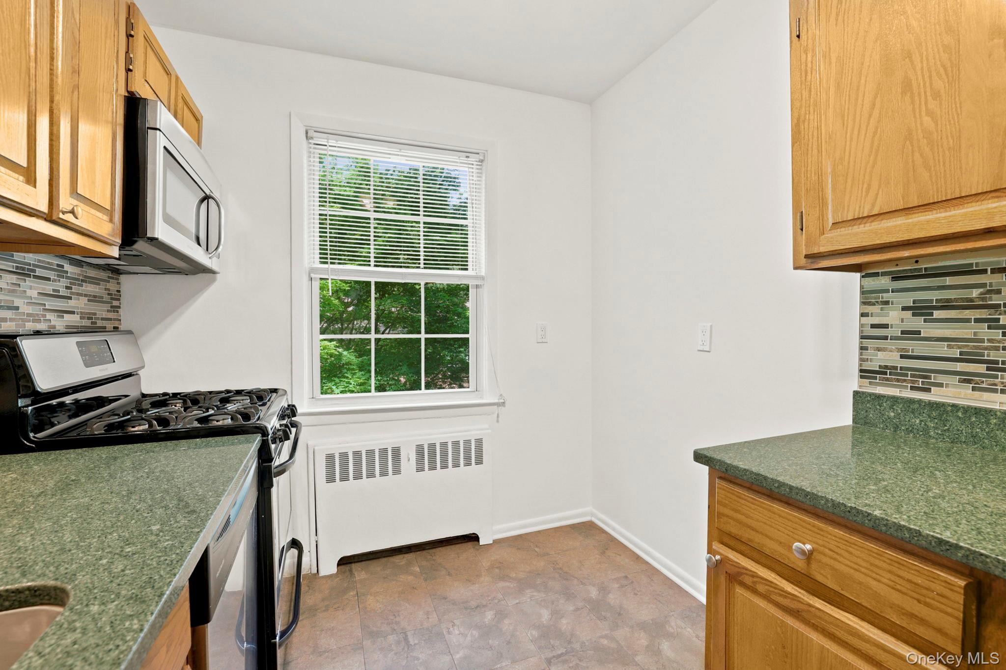 186 Pinewood Road, Unit 56 Hartsdale, NY 10530 - Photo 10 of 29 Here is where you can place your bistro table and chairs for your casual morning coffee while listening to the birds in the tree outside