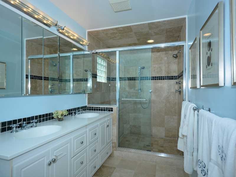 12 Ensign Road Rowayton, CT 06853 - Photo 15 of 24 a bathroom with a granite countertop sink a mirror and shower
