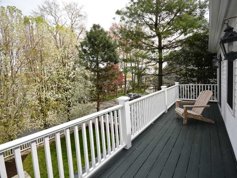 12 Ensign Road Rowayton, CT 06853 - Photo 16 of 24 a view of a wooden deck with a bench