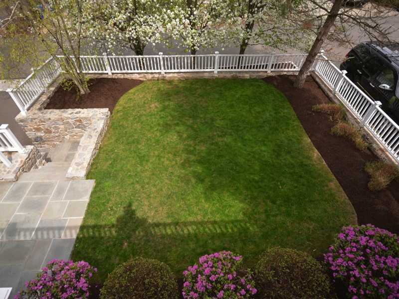 12 Ensign Road Rowayton, CT 06853 - Photo 17 of 24 a view of a garden with a patio