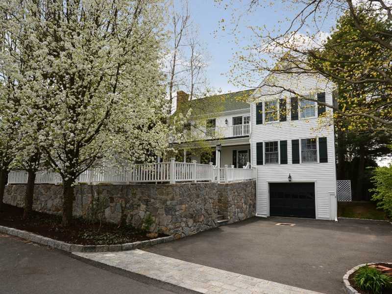 12 Ensign Road Rowayton, CT 06853 - Photo 2 of 24 a front view of a house with a garden