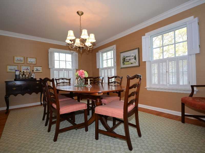 12 Ensign Road Rowayton, CT 06853 - Photo 9 of 24 a view of a dining room with furniture and chandelier