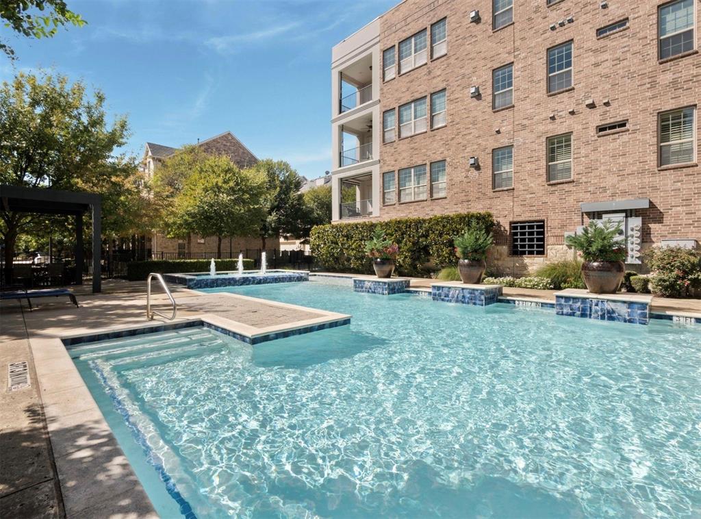 5001 Meridian Lane, Unit 2103 Addison, TX 75001 - Photo 24 of 26 Outdoor swimming pool featuring a tiled spa, integrated fountains, and surrounding hardscaping