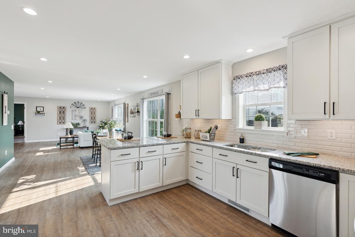 474 Riverside Avenue Trenton, NJ 08618 - Photo 3 of 9 a large white kitchen with sink and cabinets