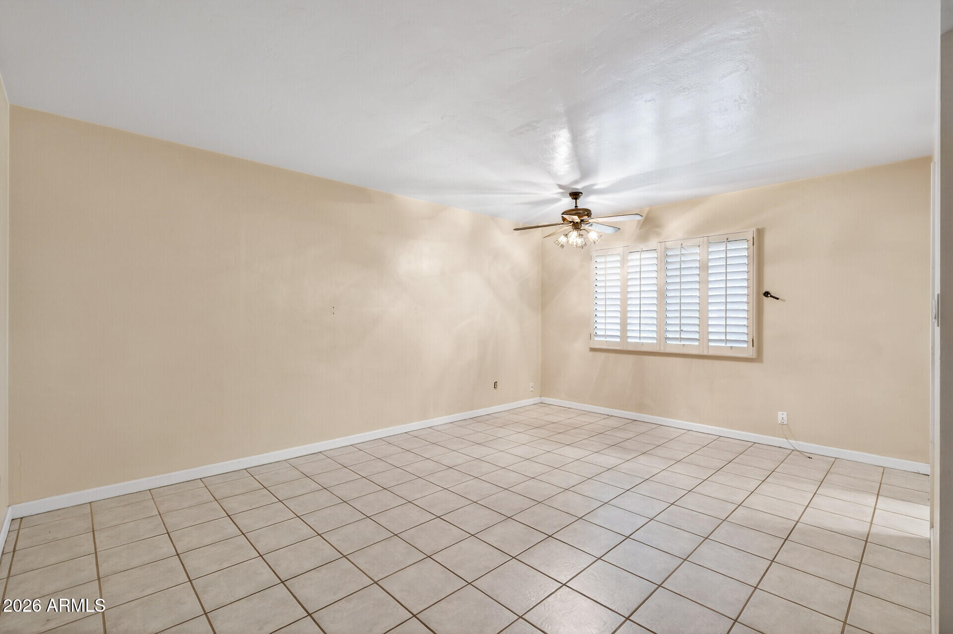 7730 North 7th Avenue Phoenix, AZ 85021 - Photo 12 of 14 a view of an empty room with a window