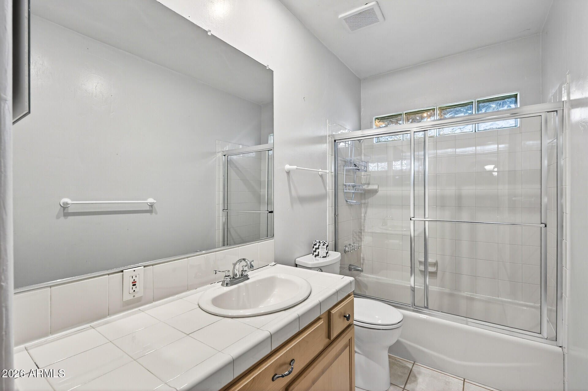7730 North 7th Avenue Phoenix, AZ 85021 - Photo 13 of 14 a bathroom with a sink a toilet and shower