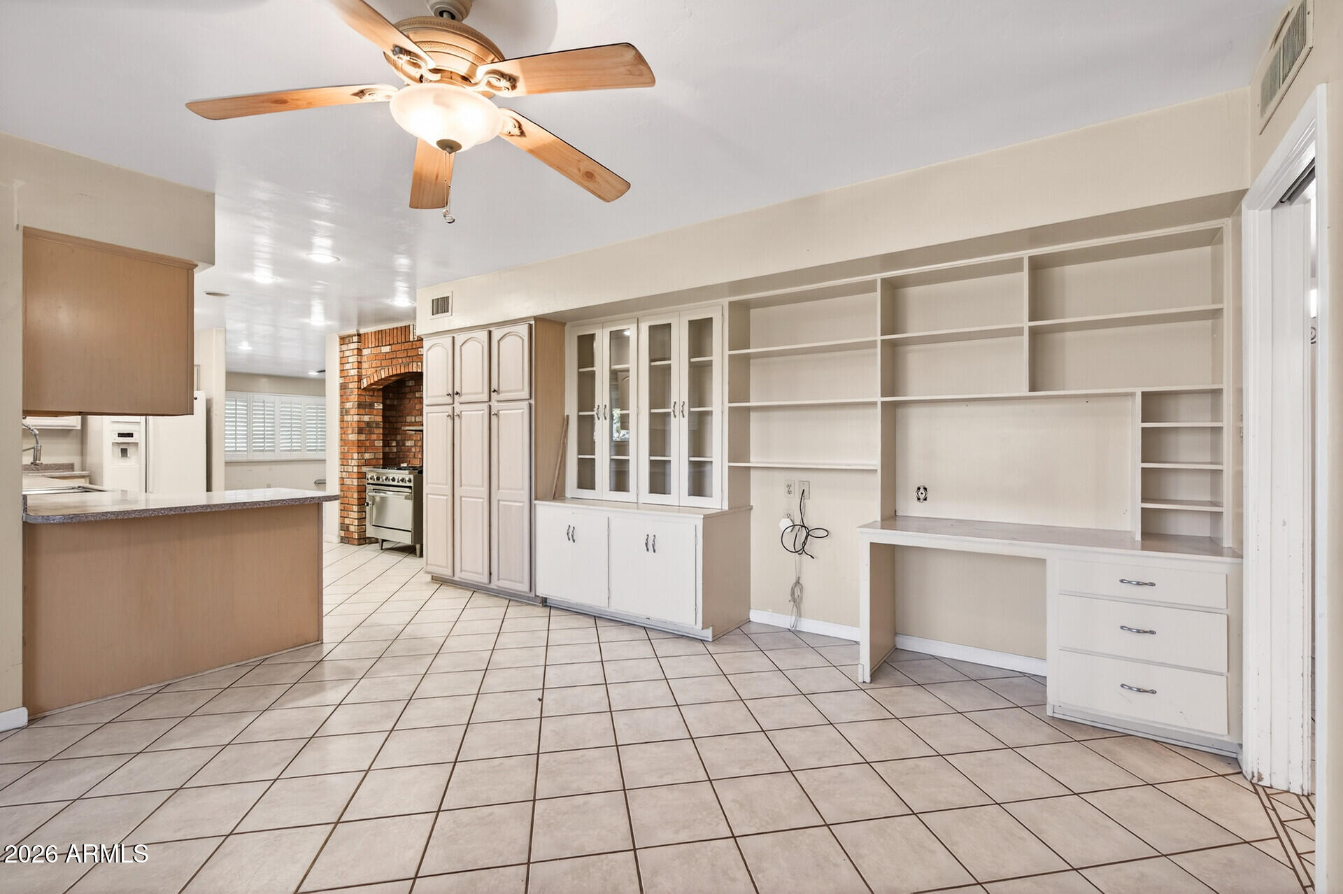 7730 North 7th Avenue Phoenix, AZ 85021 - Photo 3 of 14 a view of cabinets and window