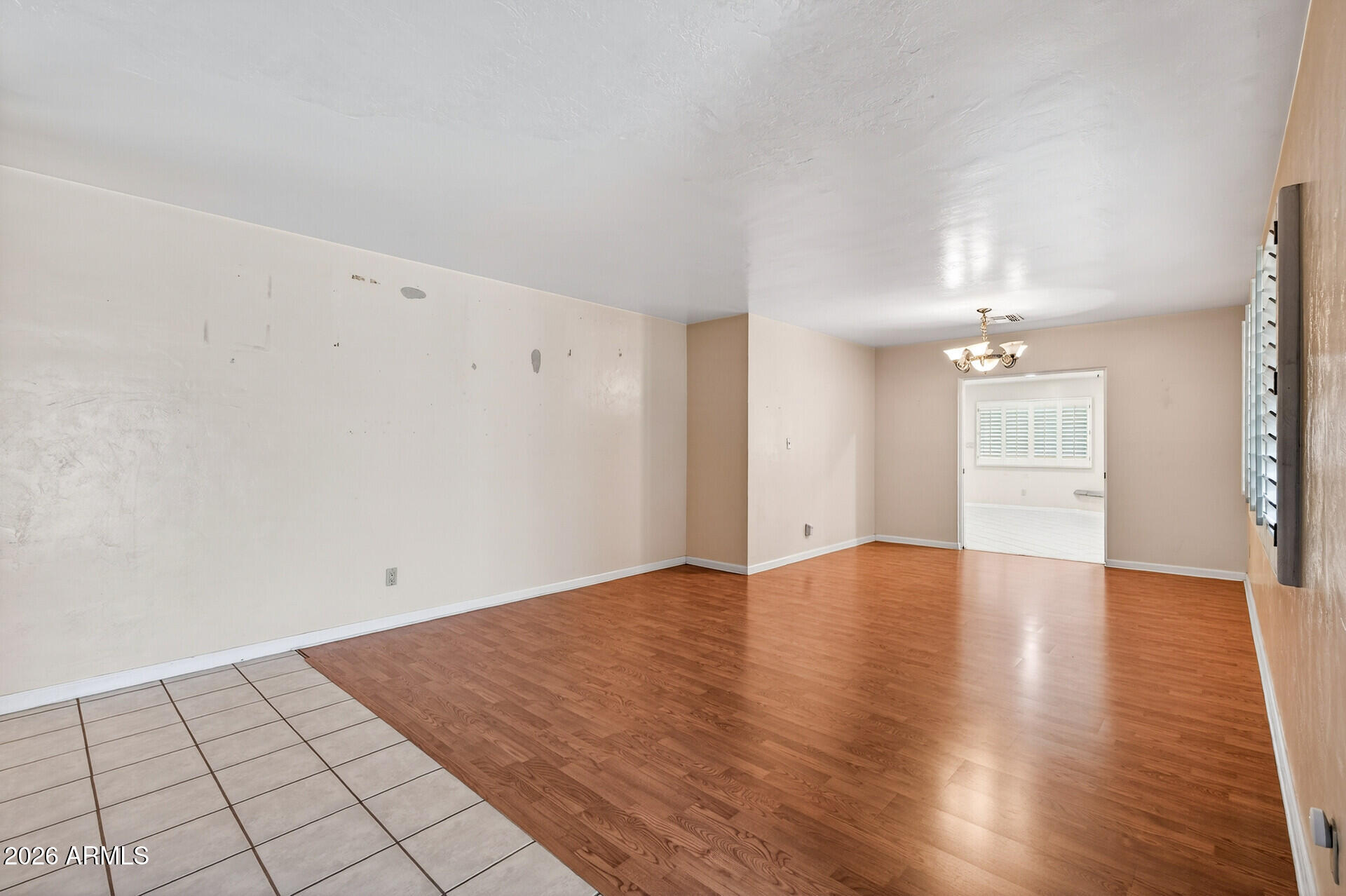 7730 North 7th Avenue Phoenix, AZ 85021 - Photo 4 of 14 an empty room with wooden floor