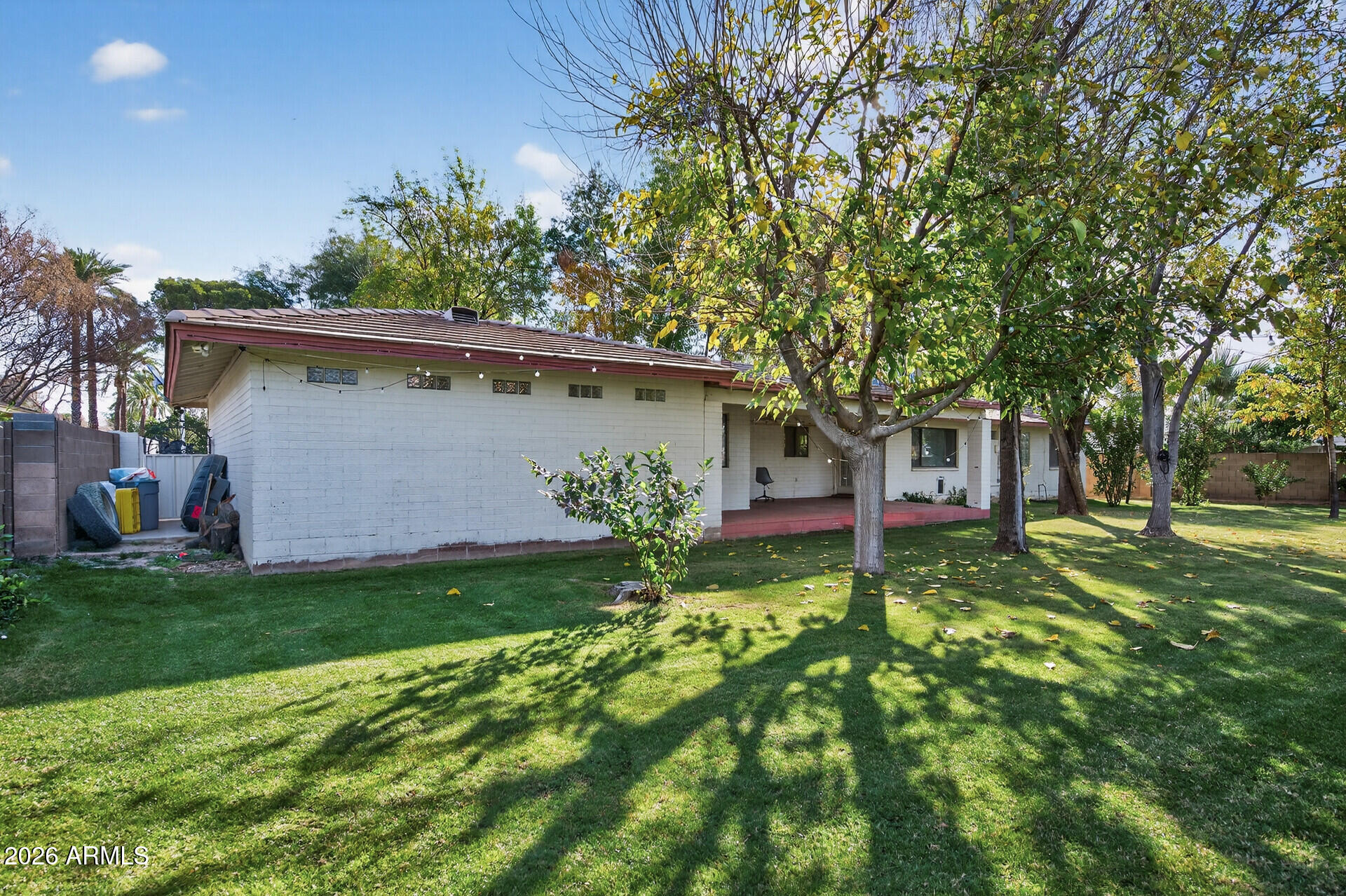 7730 North 7th Avenue Phoenix, AZ 85021 - Photo 7 of 14 a backyard of a house with table and chairs