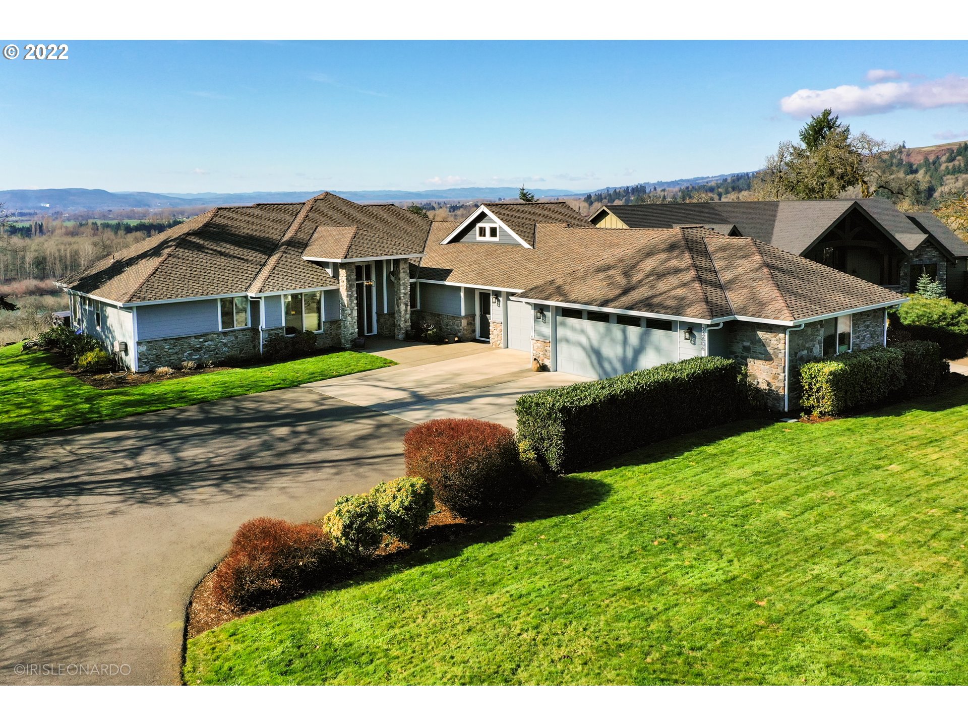 33806 Northwest Norstar Ranch Road Ridgefield, WA 98642 - Photo 1 of 32 a front view of a house with garden